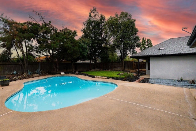 view of swimming pool featuring a patio, a fenced backyard, and a fenced in pool