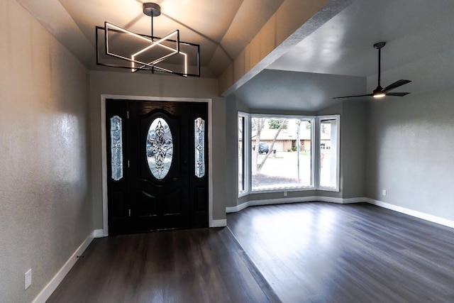 entryway with dark wood finished floors and baseboards