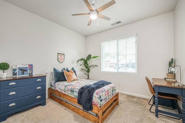 bedroom featuring visible vents, baseboards, light colored carpet, and ceiling fan