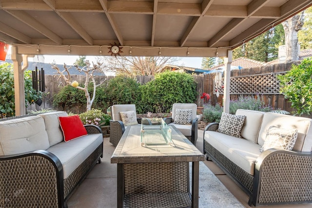 view of patio / terrace featuring an outdoor hangout area and a fenced backyard