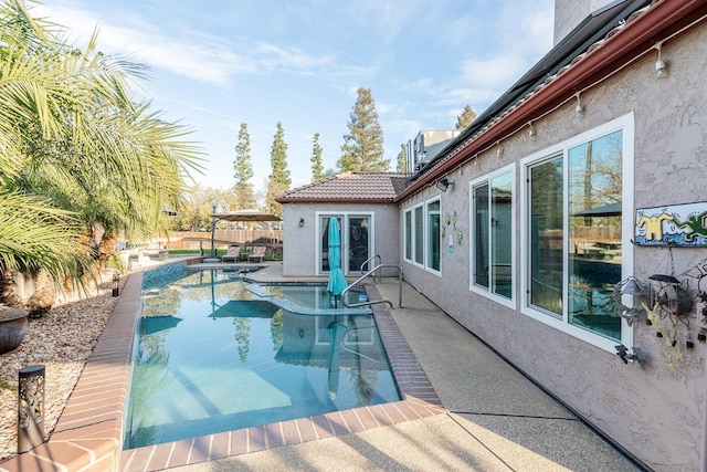 view of pool featuring a patio area, a fenced in pool, and a fenced backyard