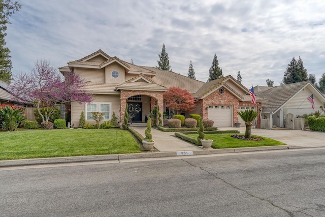851 E Country View Cir, Fresno, CA 93730 - traditional-style home featuring concrete driveway, a tile roof, and a garage