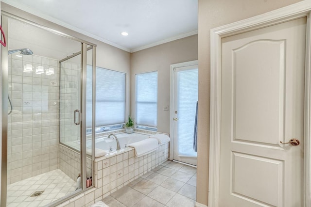 bathroom featuring tile patterned flooring, a shower stall, crown molding, and a garden tub