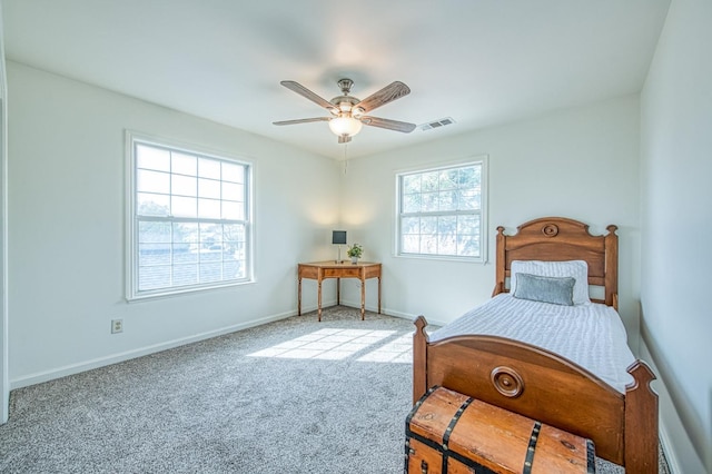 bedroom with carpet flooring, baseboards, visible vents, and ceiling fan