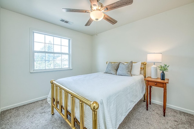 bedroom featuring baseboards, visible vents, carpet floors, and ceiling fan