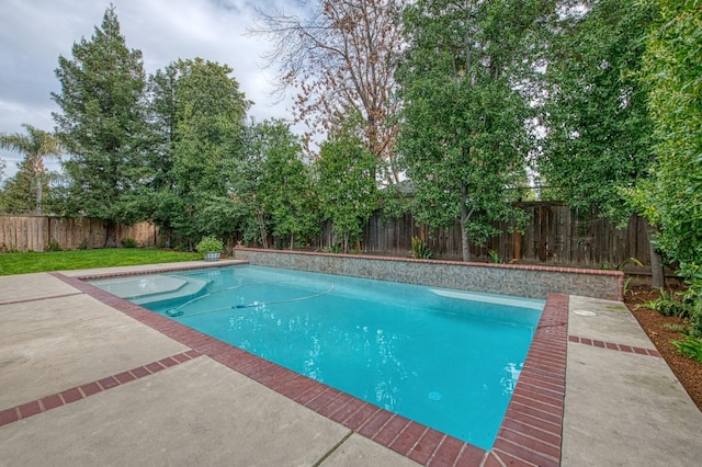 view of swimming pool featuring a patio area, a fenced backyard, and a fenced in pool