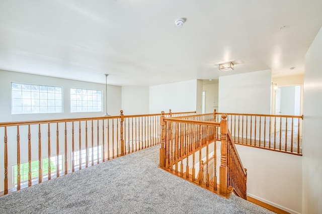 hallway with carpet flooring