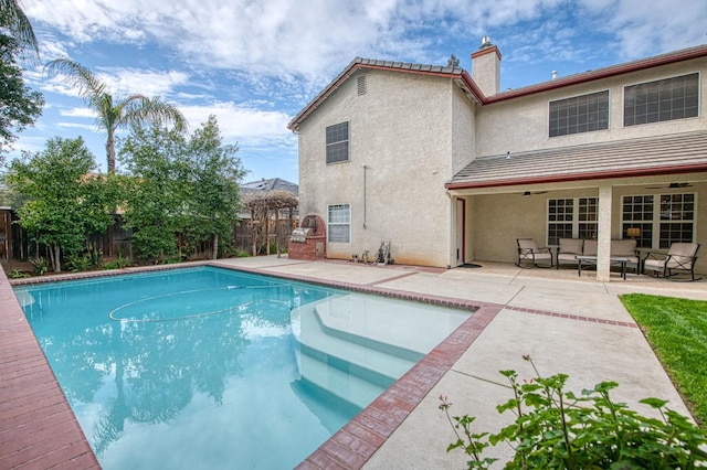 view of pool with outdoor lounge area, a patio area, a fenced backyard, and a fenced in pool