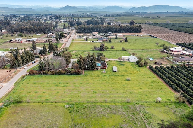 drone / aerial view featuring a rural view and a mountain view