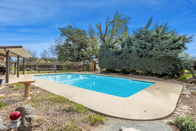 view of swimming pool featuring a fenced in pool, a pergola, a patio, and fence