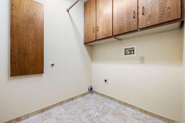 laundry room with electric dryer hookup, cabinet space, and hookup for a washing machine