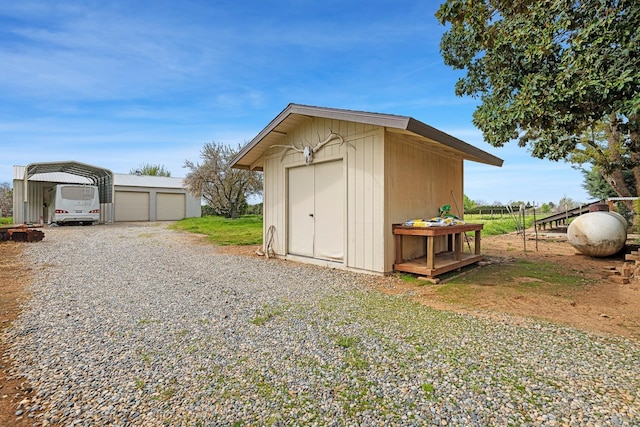 view of shed featuring a carport