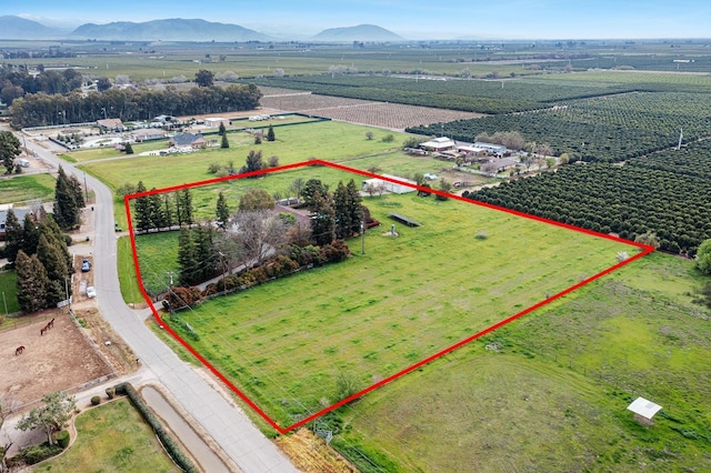 birds eye view of property featuring a rural view and a mountain view