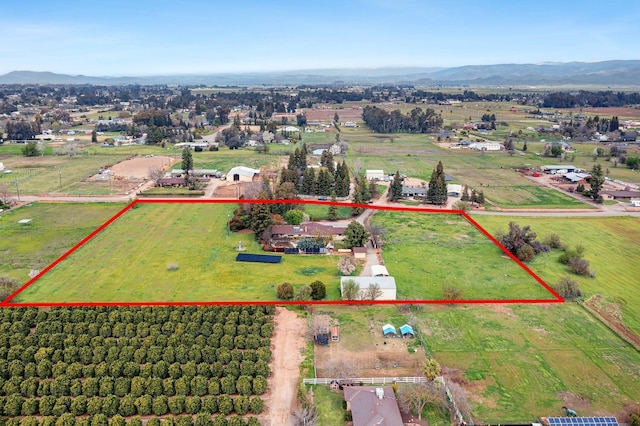 birds eye view of property with a rural view and a mountain view