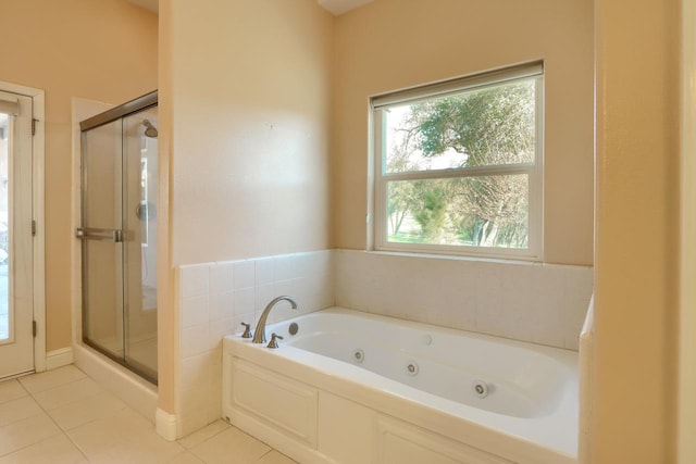 bathroom with tile patterned floors, a stall shower, and a whirlpool tub