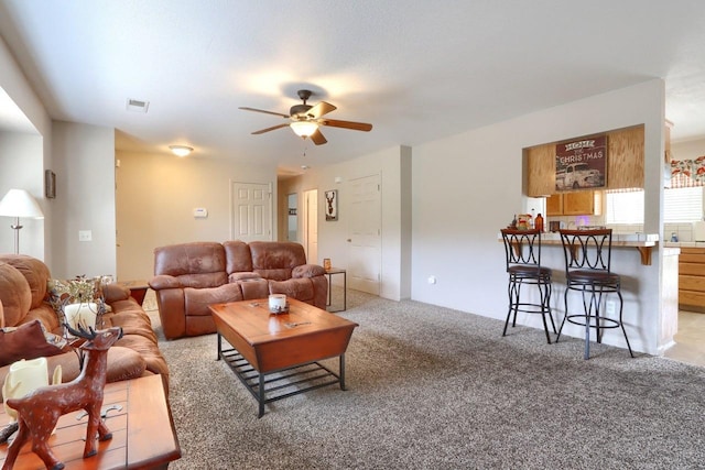 29878 Deer Trail Ln, Coarsegold, CA 93614 - living room with visible vents, ceiling fan, and light colored carpet