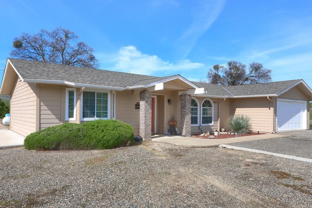 29878 Deer Trail Ln, Coarsegold, CA 93614 - single story home featuring an attached garage, a shingled roof, and driveway