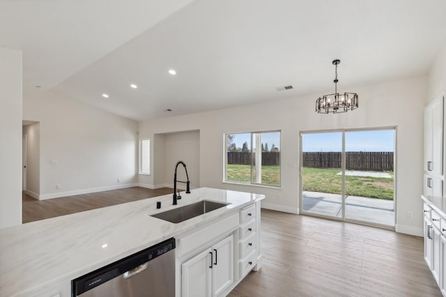 819 Hill Ave, Fowler, CA 93625 - kitchen featuring a sink, stainless steel dishwasher, light wood-style flooring, light stone counters, and recessed lighting