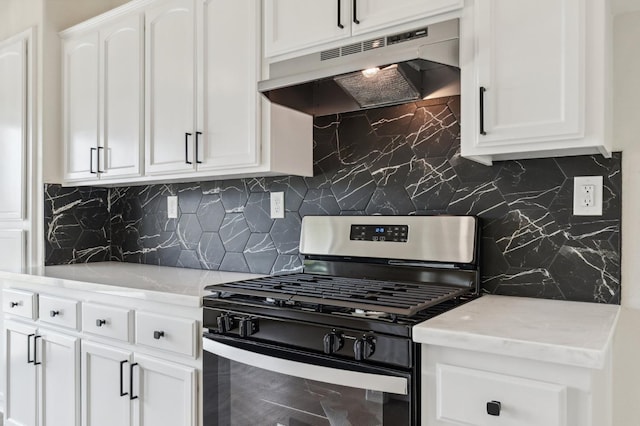 819 Hill Ave, Fowler, CA 93625 - kitchen with stainless steel range with gas cooktop, under cabinet range hood, white cabinets, and backsplash