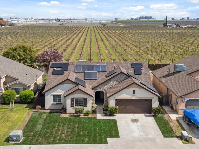 birds eye view of property with a rural view