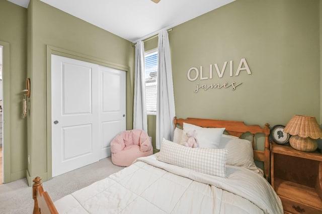 bedroom with a closet and carpet floors