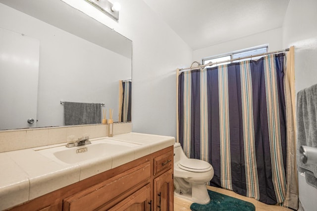 3622 W Terrace Ave, Fresno, CA 93722 - bathroom with vanity, toilet, a shower with shower curtain, and tile patterned floors