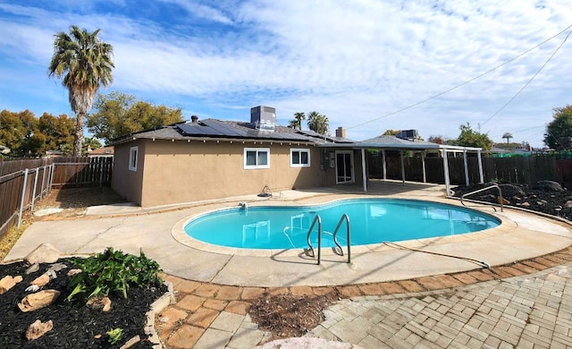 view of swimming pool featuring a fenced in pool, a patio, and a fenced backyard