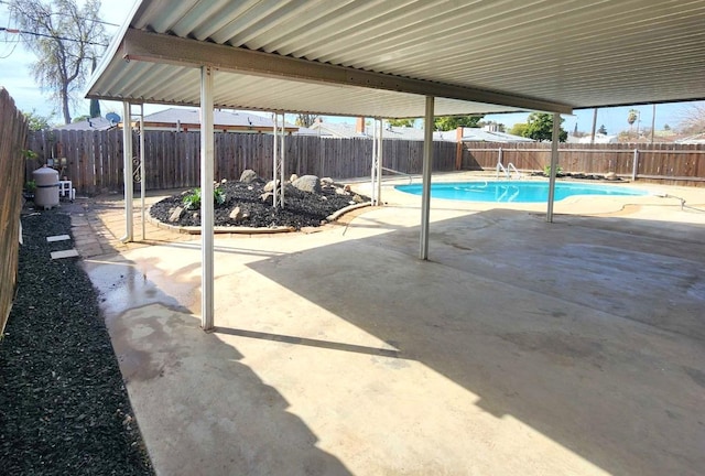 view of swimming pool with a patio area, a fenced in pool, and a fenced backyard