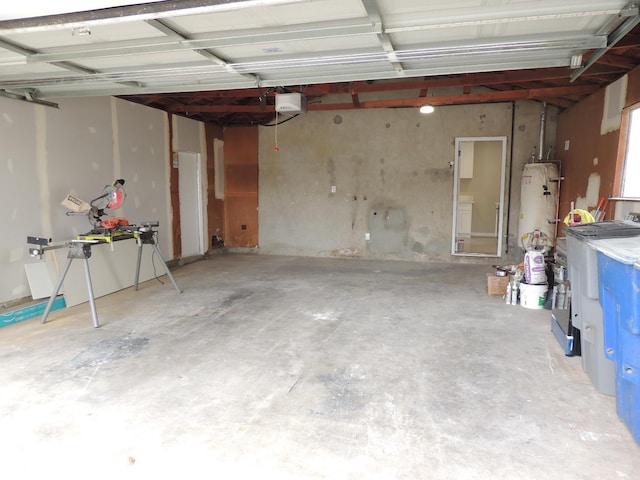 garage featuring gas water heater and a garage door opener