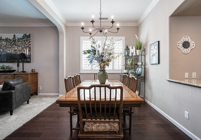 dining space featuring arched walkways, crown molding, and wood finished floors