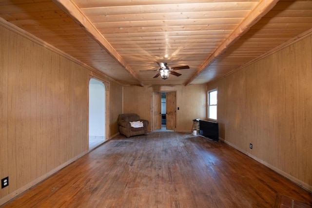 interior space featuring baseboards, ceiling fan, wooden ceiling, wood finished floors, and arched walkways