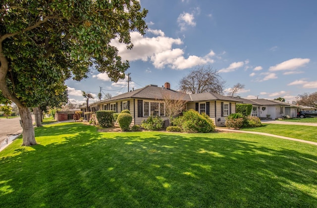 107 W Garland Ave, Fresno, CA 93705 - ranch-style home featuring a front lawn and a chimney