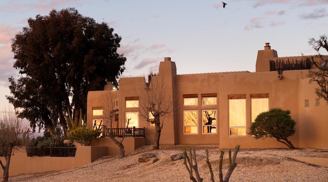 view of side of property with stucco siding