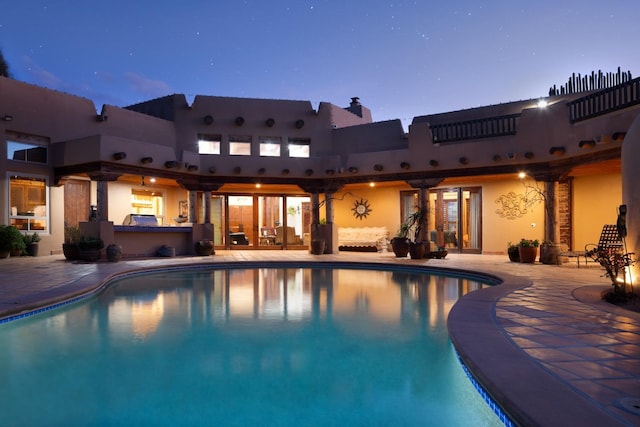 outdoor pool featuring a patio