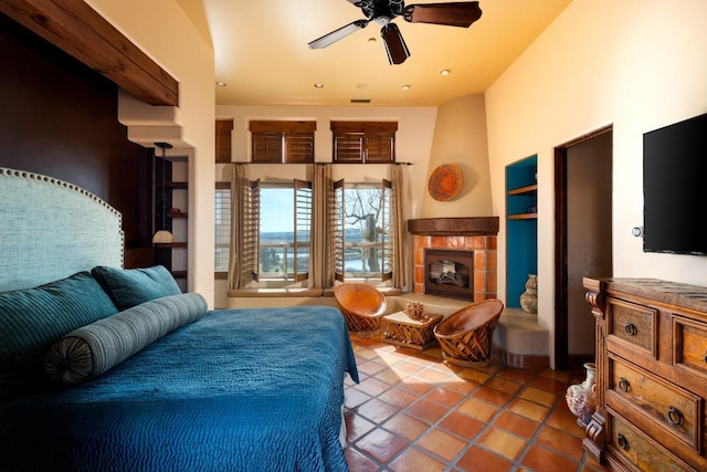 bedroom featuring recessed lighting, a fireplace, and tile patterned flooring