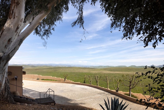 exterior space featuring a rural view and a mountain view