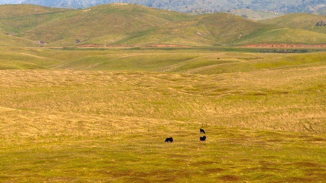 property view of mountains featuring a rural view