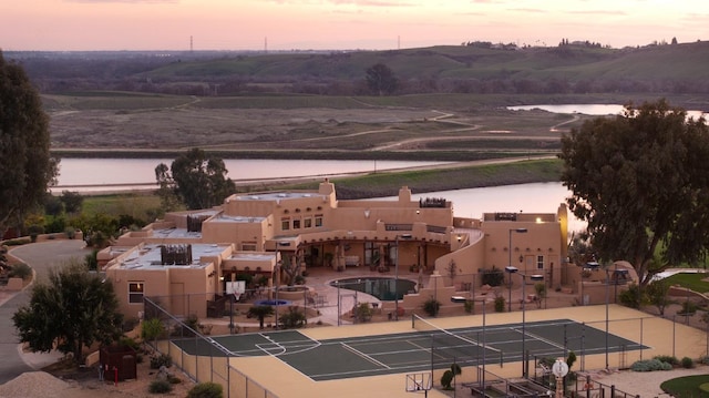 aerial view at dusk with a water view