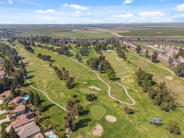 birds eye view of property with golf course view