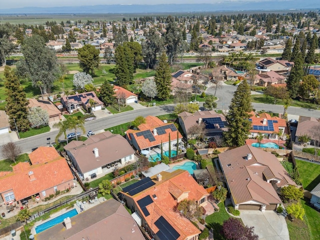 birds eye view of property with a residential view