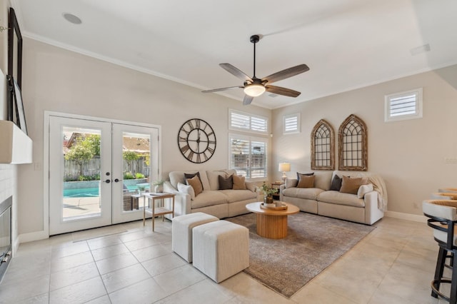 living room with crown molding, a healthy amount of sunlight, french doors, and ceiling fan