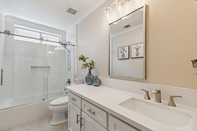 bathroom with visible vents, vanity, toilet, and crown molding