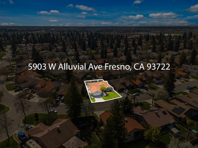 birds eye view of property with a residential view