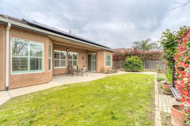 view of yard with a patio area and a fenced backyard