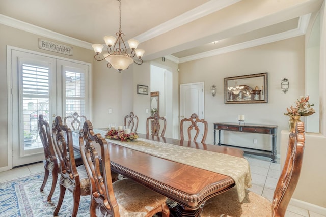 dining area with a notable chandelier, a healthy amount of sunlight, light tile patterned flooring, and ornamental molding