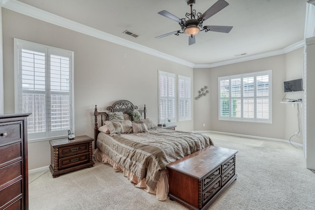 bedroom with baseboards, light colored carpet, visible vents, and ornamental molding