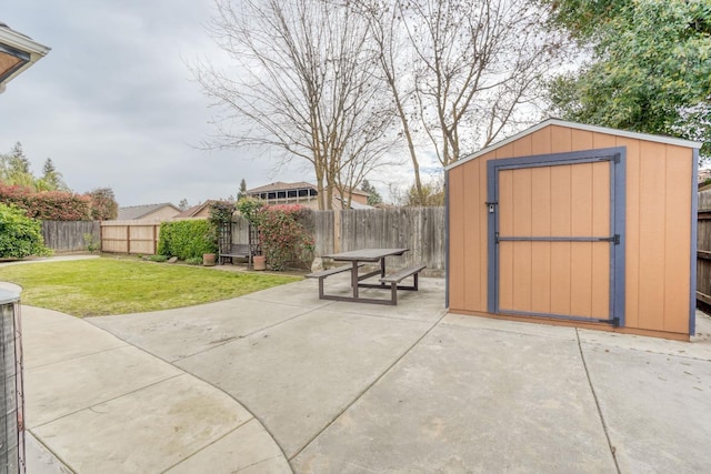 view of shed with a fenced backyard