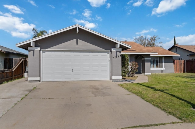 ranch-style house with a front lawn, fence, driveway, and stucco siding