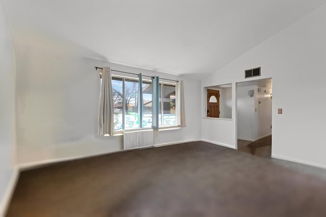 3213 Clogston Way, Modesto, CA 95354 - unfurnished room featuring radiator, dark carpet, lofted ceiling, and baseboards