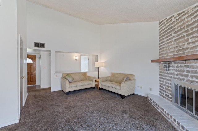 carpeted living room with a high ceiling, baseboards, and visible vents